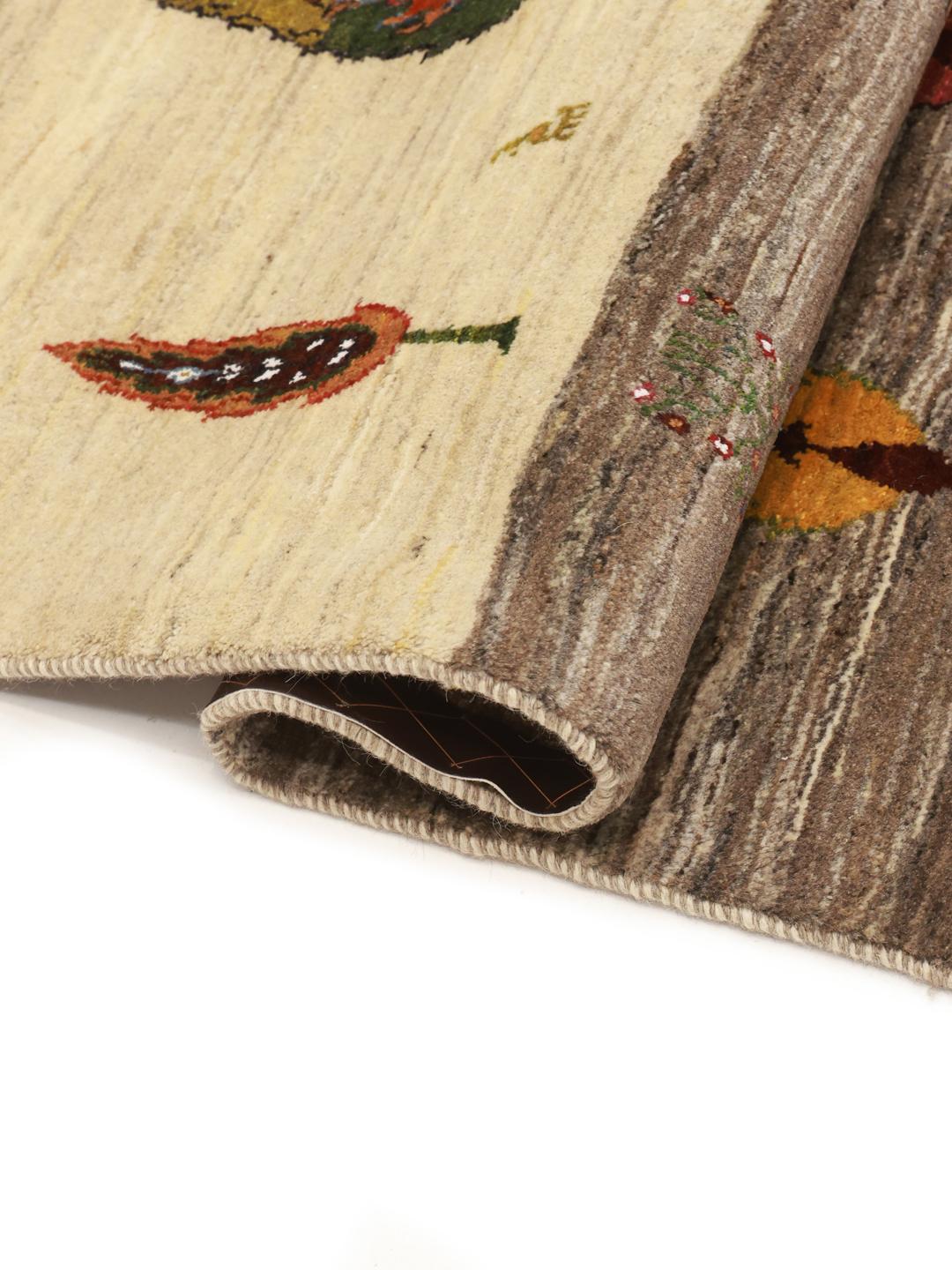 Hand-knotted Gabbeh rug from the Middle East featuring tree motifs in brown and beige colours.