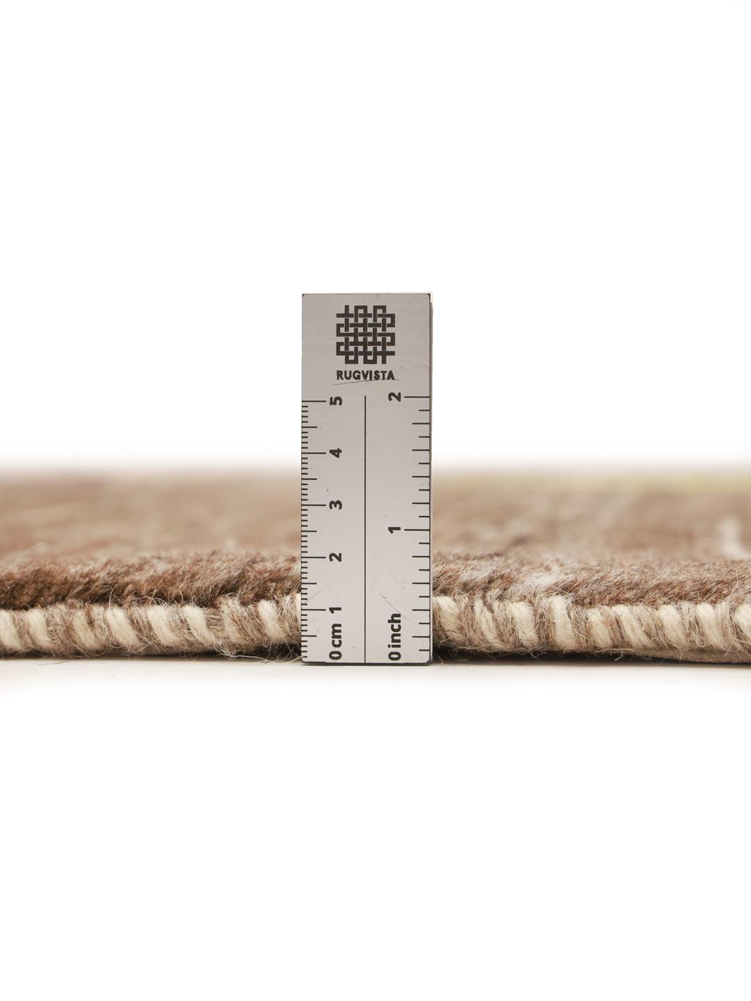 Hand-knotted Gabbeh rug from the Middle East featuring tree motifs in brown and beige colours.