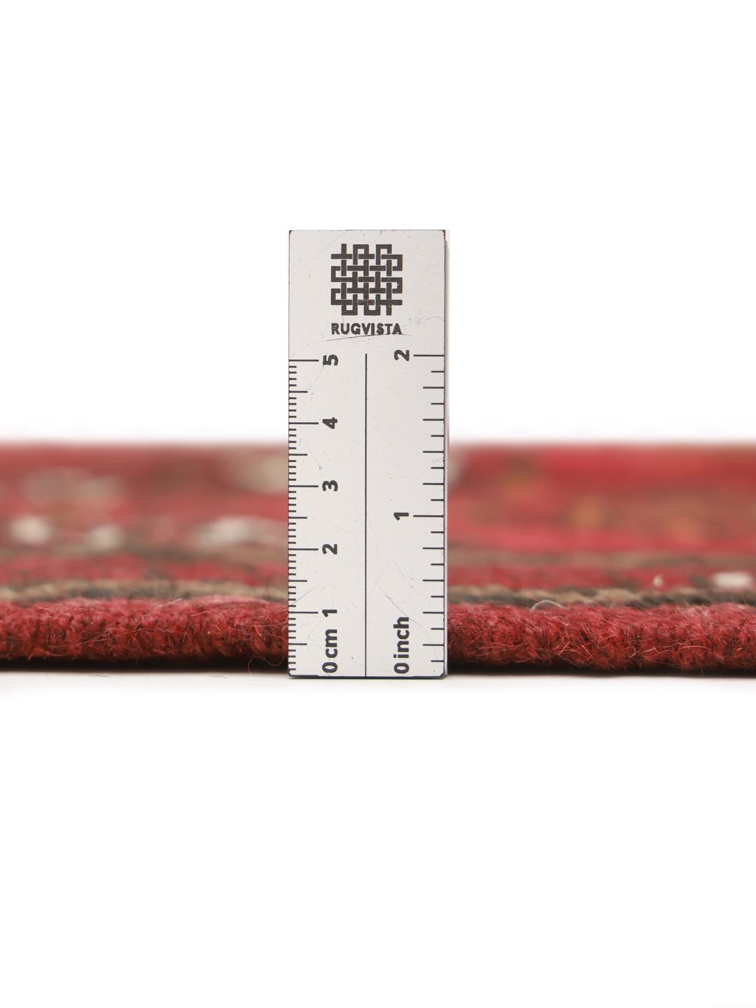 Hand-knotted Turkaman wool rug from the Middle East in dark-red and black