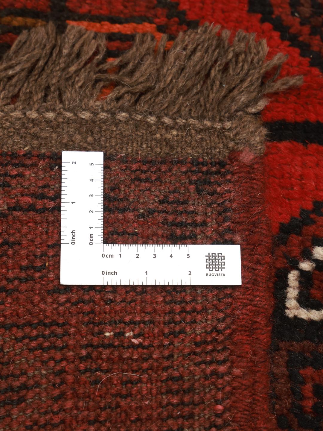 Hand-knotted Turkaman wool rug from the Middle East in dark-red and black