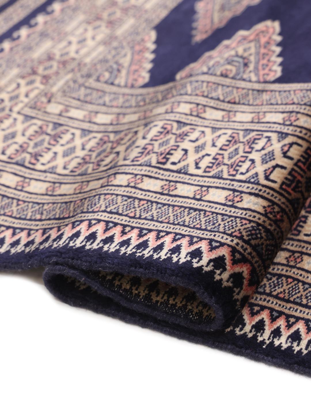 Hand-knotted Pakistan rug with deep blue field and geometric motifs
