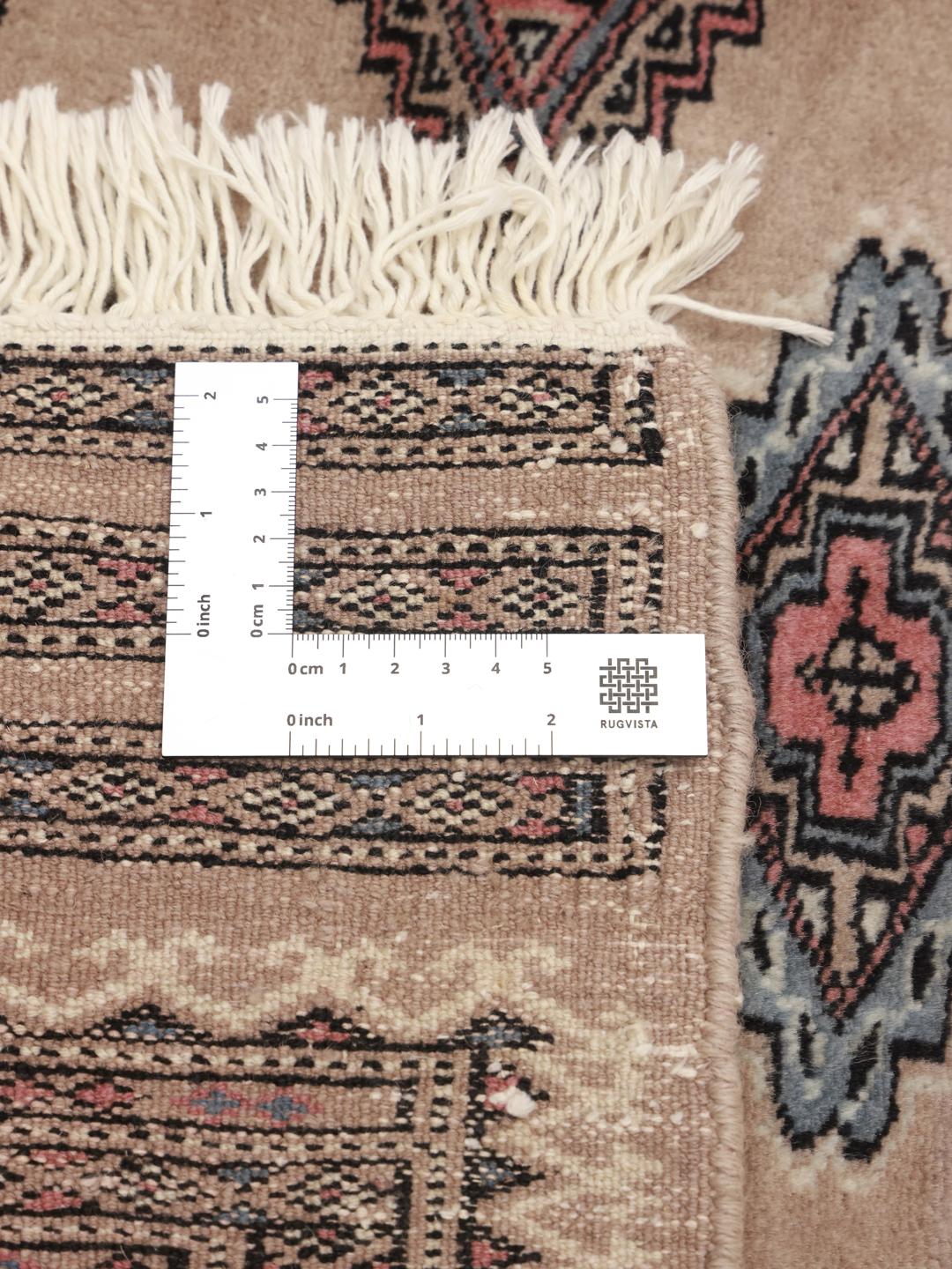 Hand-knotted Pakistani rug with traditional beige geometric motifs