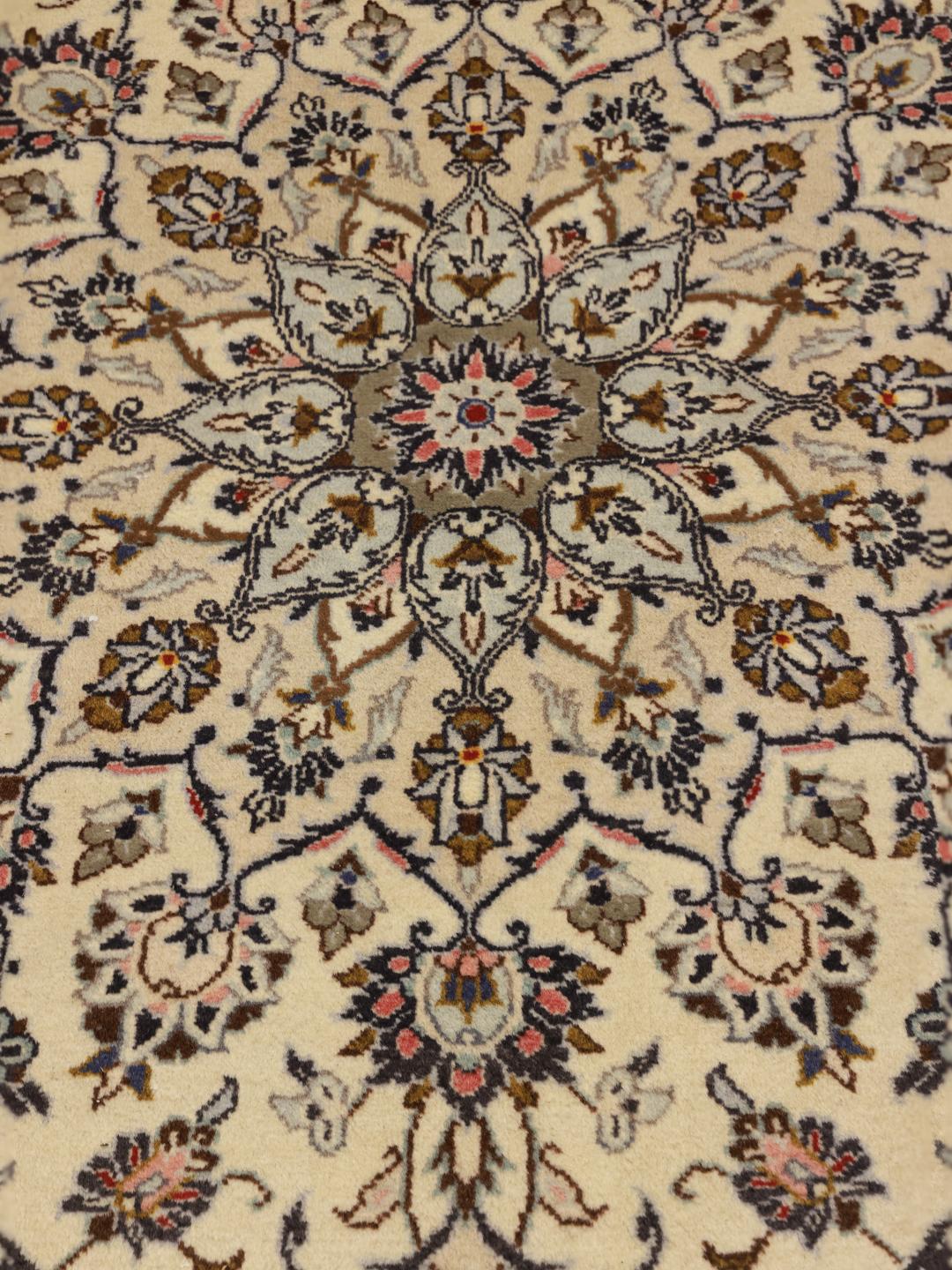 Hand-knotted Keshan rug from the Middle East with a floral medallion pattern in beige