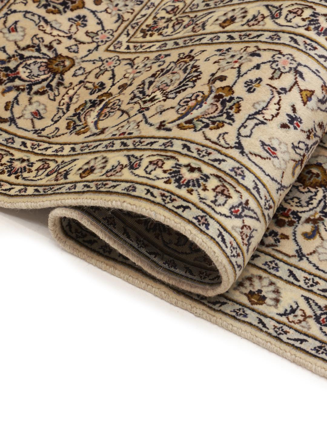 Hand-knotted Keshan rug from the Middle East with a floral medallion pattern in beige