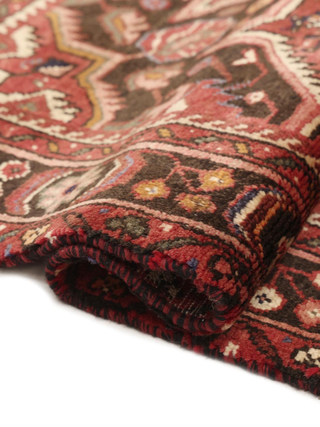 Hand-knotted Hosseinabad rug from the Middle East in dark-red tones