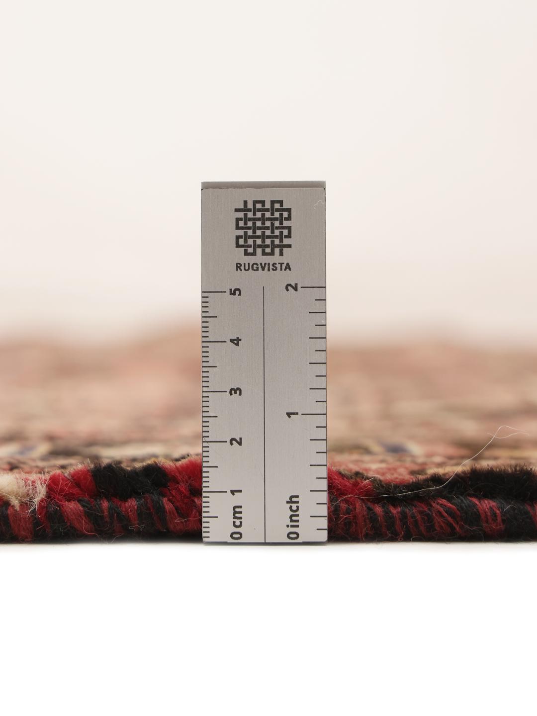 Hand-knotted Hosseinabad rug from the Middle East in dark-red tones