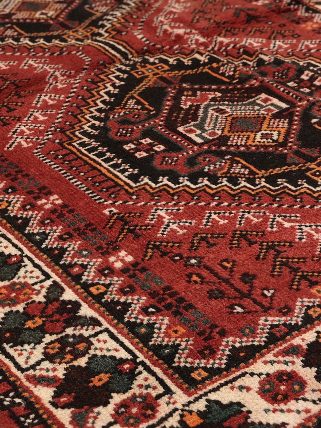 Hand-knotted Middle Eastern Shiraz rug in dark red and black with geometric patterns
