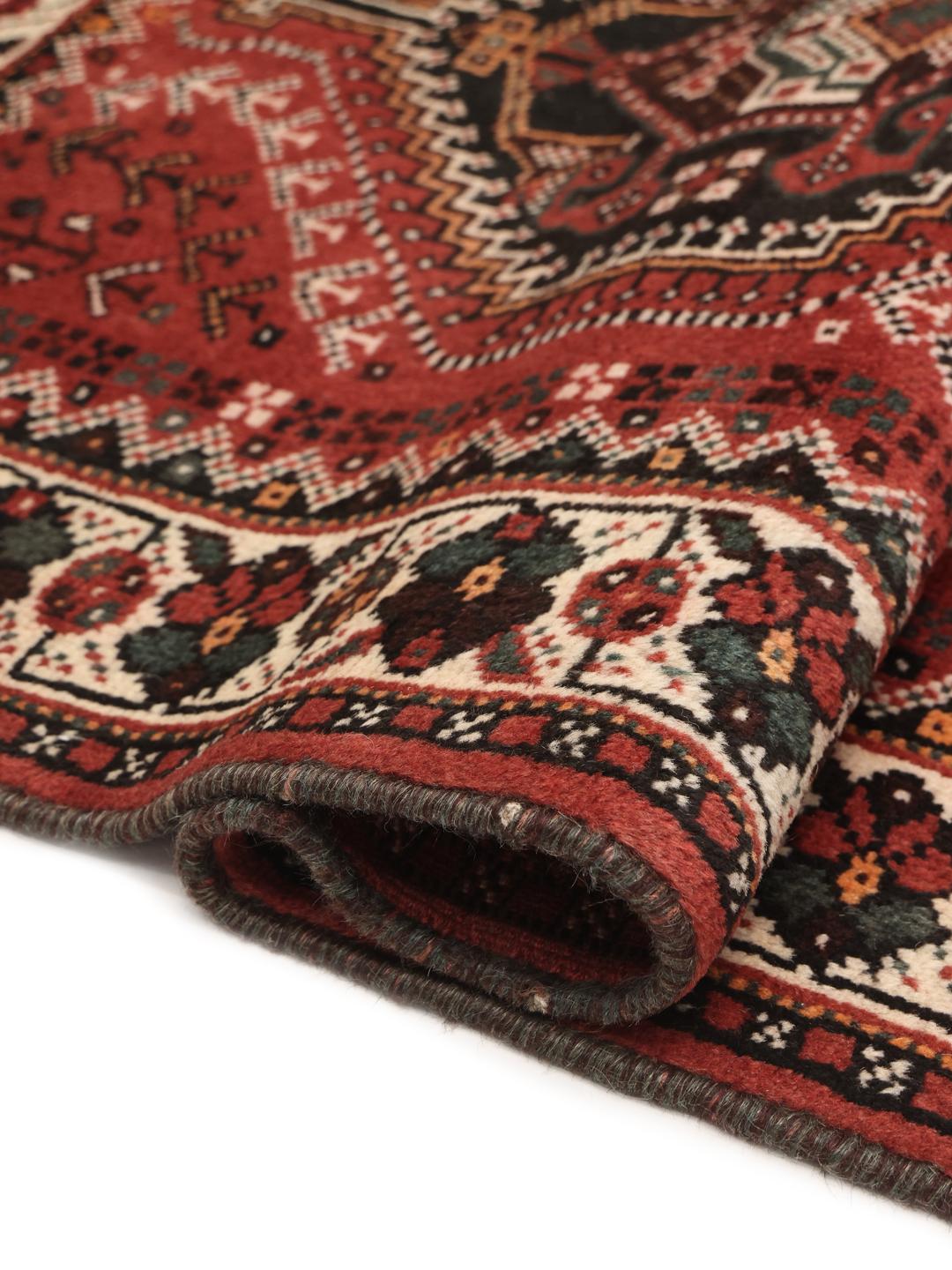 Hand-knotted Middle Eastern Shiraz rug in dark red and black with geometric patterns