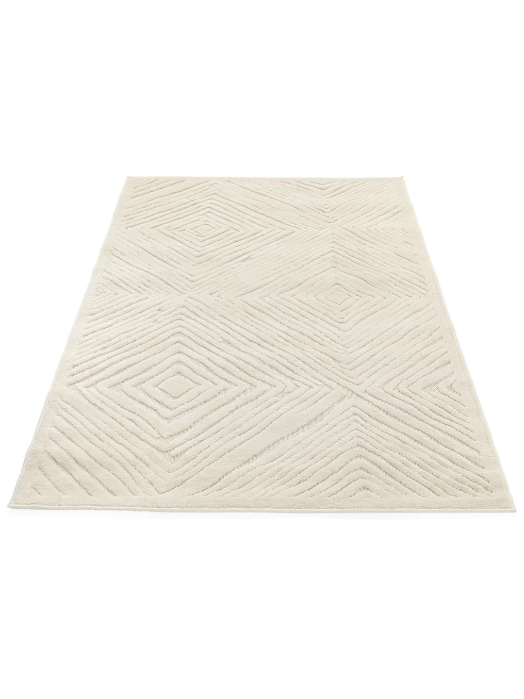 tapis blanc creme avec motif en losanges