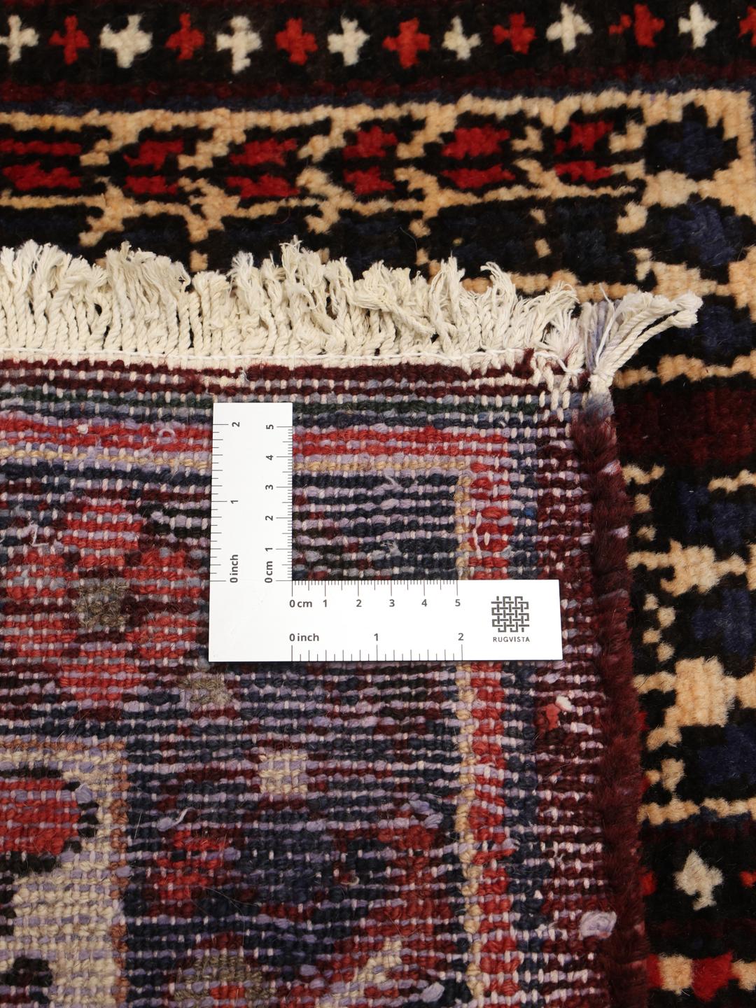 Hand-knotted Bakhtiari rug from the Middle East in dark red and multicolour hues.