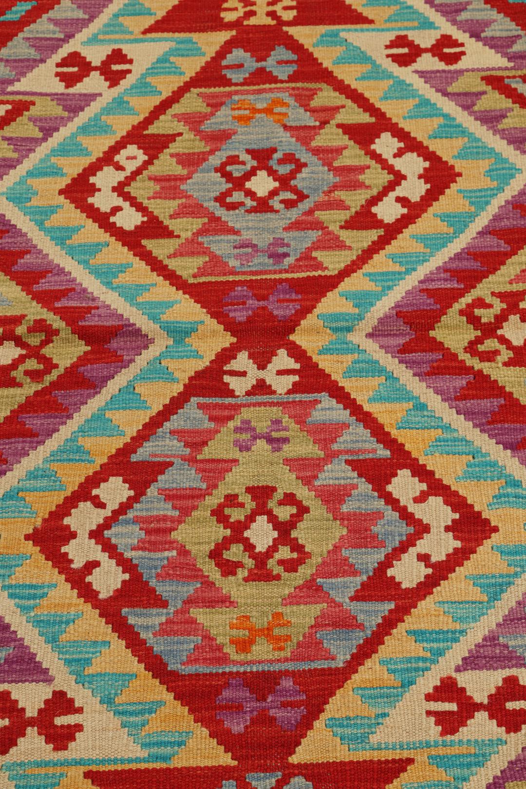 Hand-woven Afghan Kelim rug featuring geometric patterns in multicolor Wool