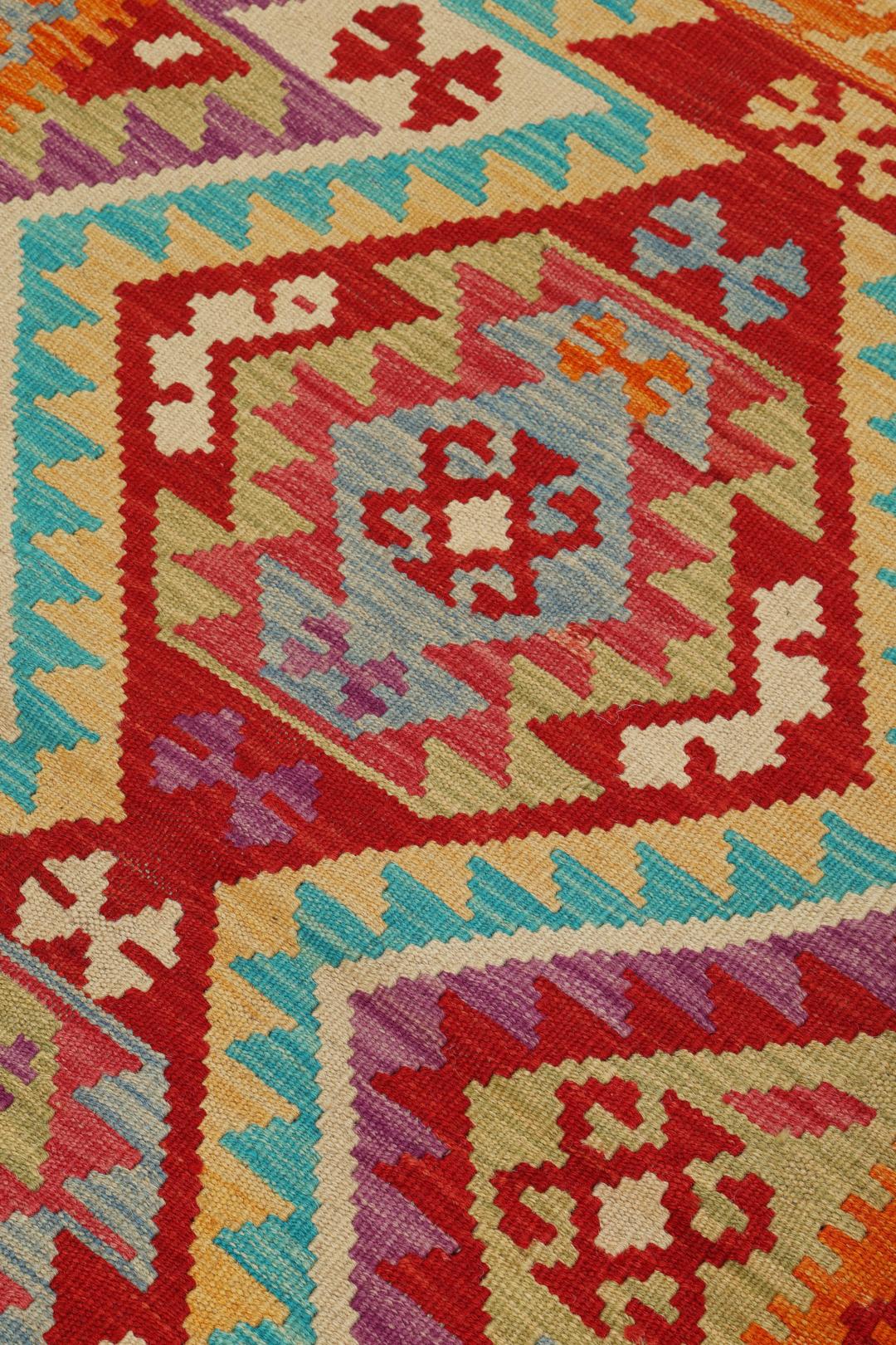 Hand-woven Afghan Kelim rug featuring geometric patterns in multicolor Wool