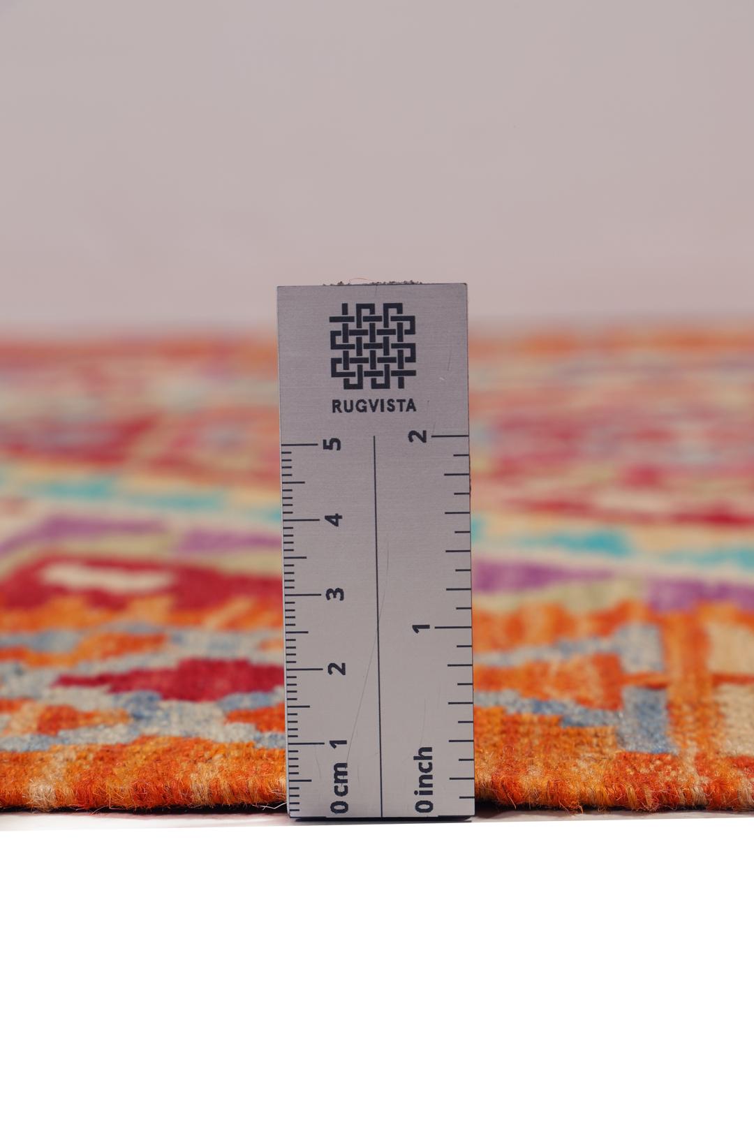 Hand-woven Afghan Kelim rug featuring geometric patterns in multicolor Wool