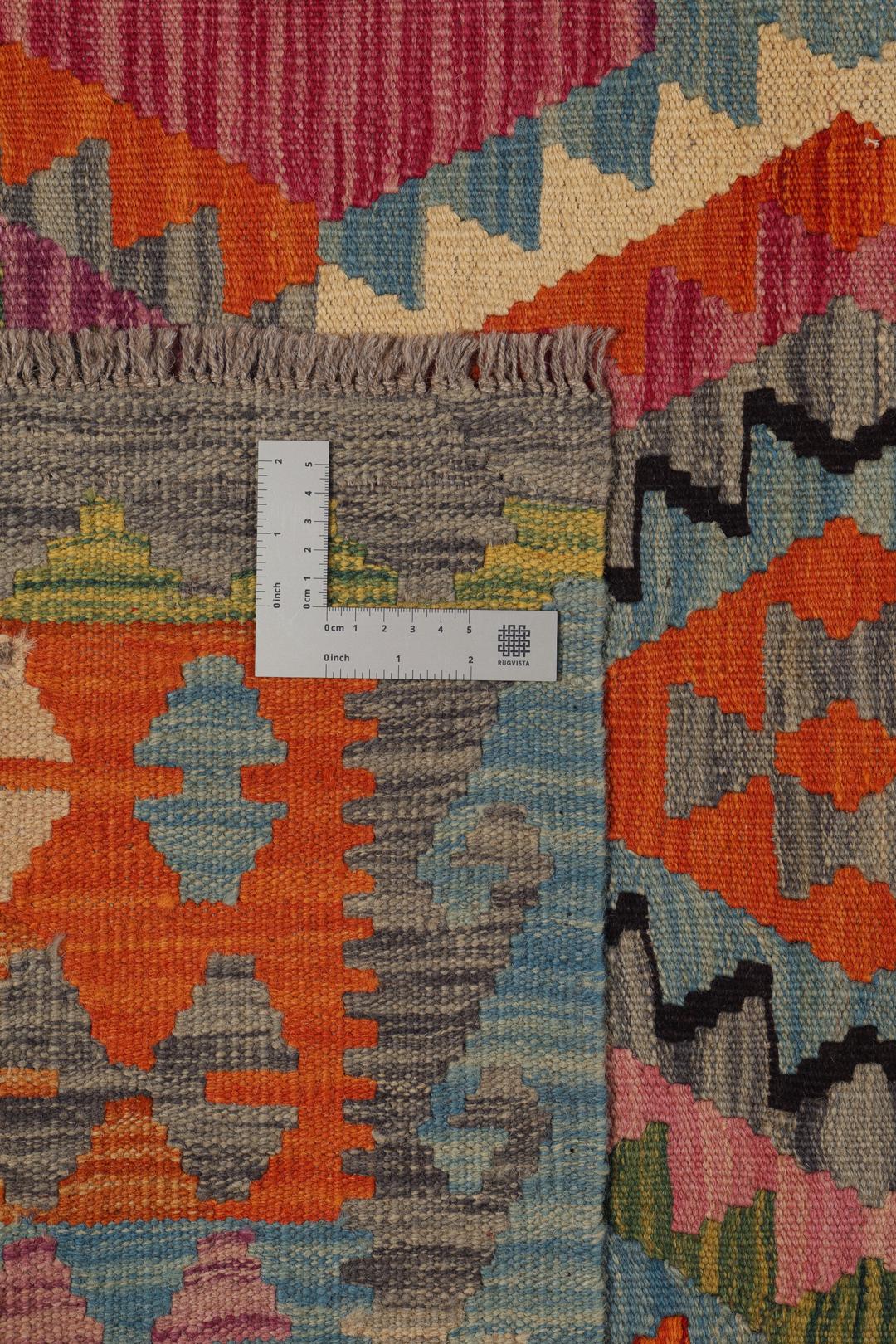 Hand-woven Afghan Kelim rug featuring vibrant geometric patterns in multicolor Wool
