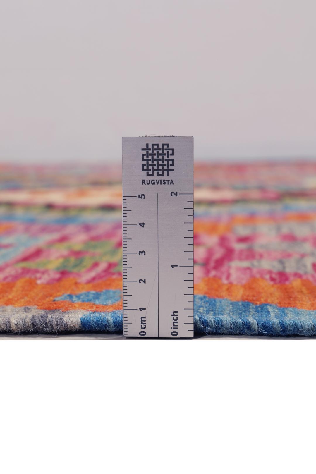 Hand-woven Afghan Kelim rug featuring vibrant geometric patterns in multicolor Wool