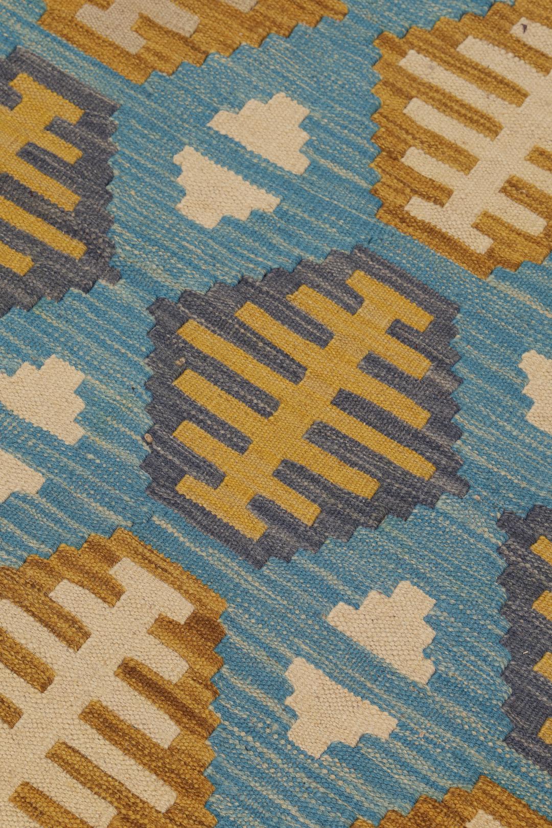 Hand-woven Afghan Kelim rug in blue and yellow with geometric patterns