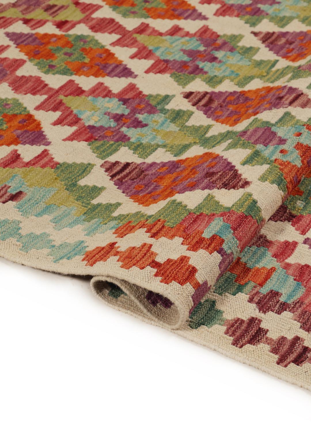 Hand-woven Afghan Kelim rug featuring a vibrant, multi-coloured geometric diamond pattern.