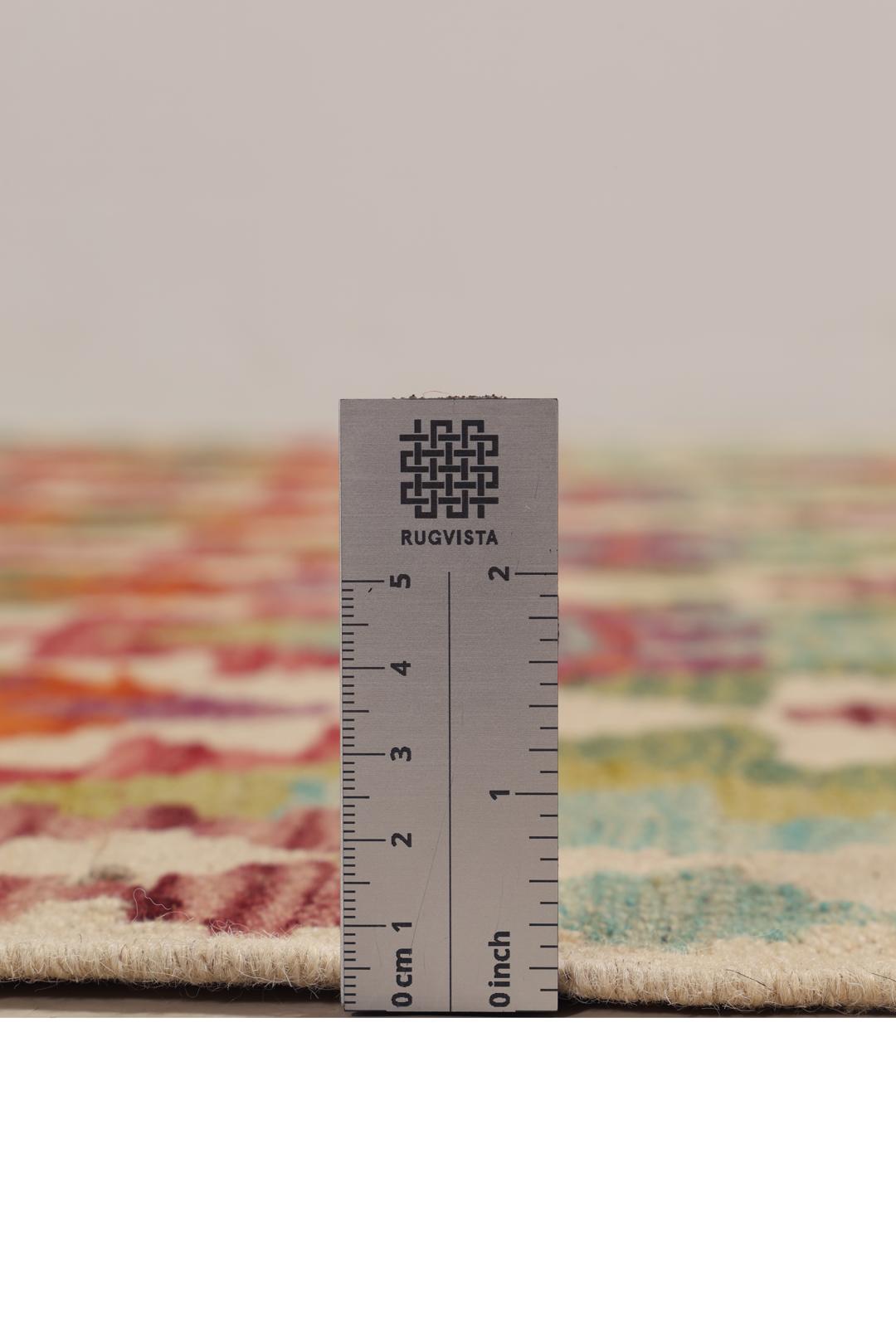 Hand-woven Afghan Kelim rug featuring a vibrant, multi-coloured geometric diamond pattern.