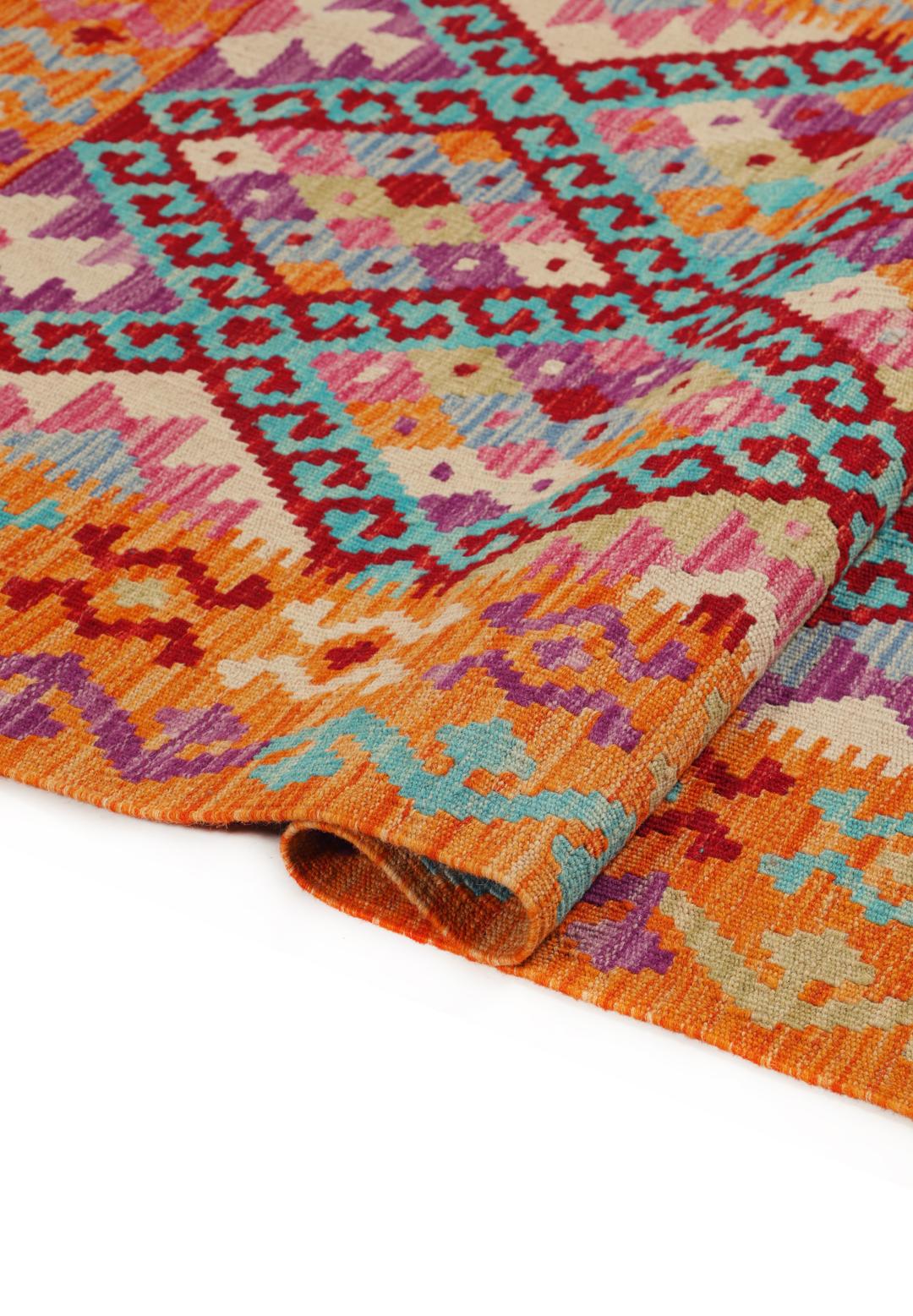 Hand-woven Afghan Kelim rug with vibrant geometric patterns in orange, teal, and purple