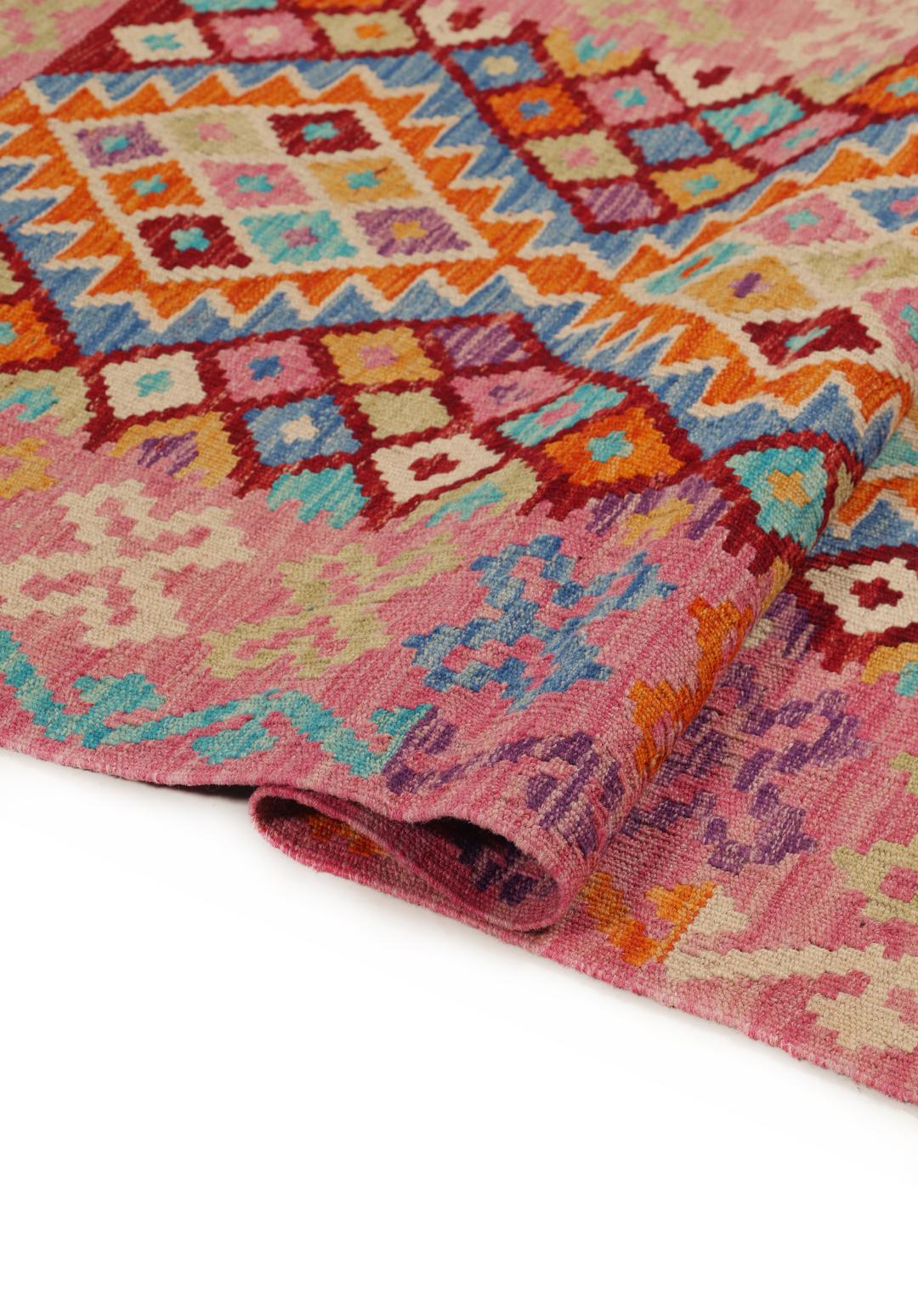 Hand-woven Afghan Kelim rug with vibrant geometric patterns in multicolor.
