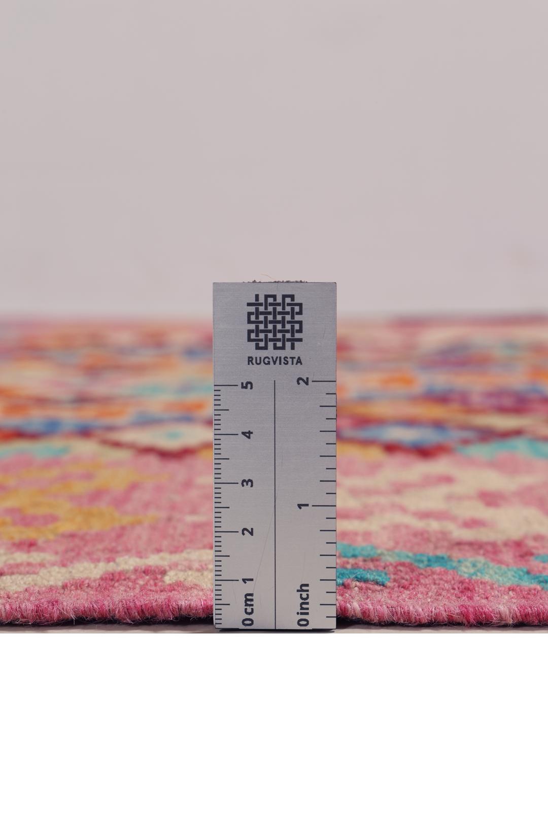Hand-woven Afghan Kelim rug with vibrant geometric patterns in multicolor.