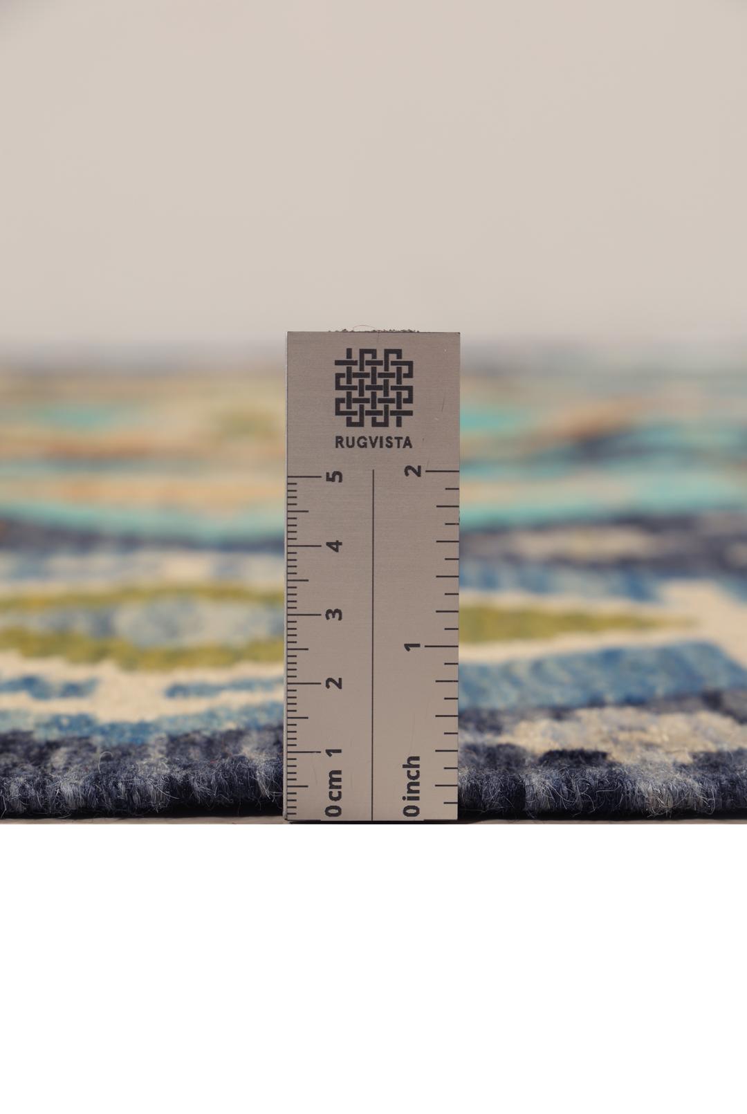 Hand-woven Afghan Kelim rug in shades of blue and teal with geometric diamond patterns