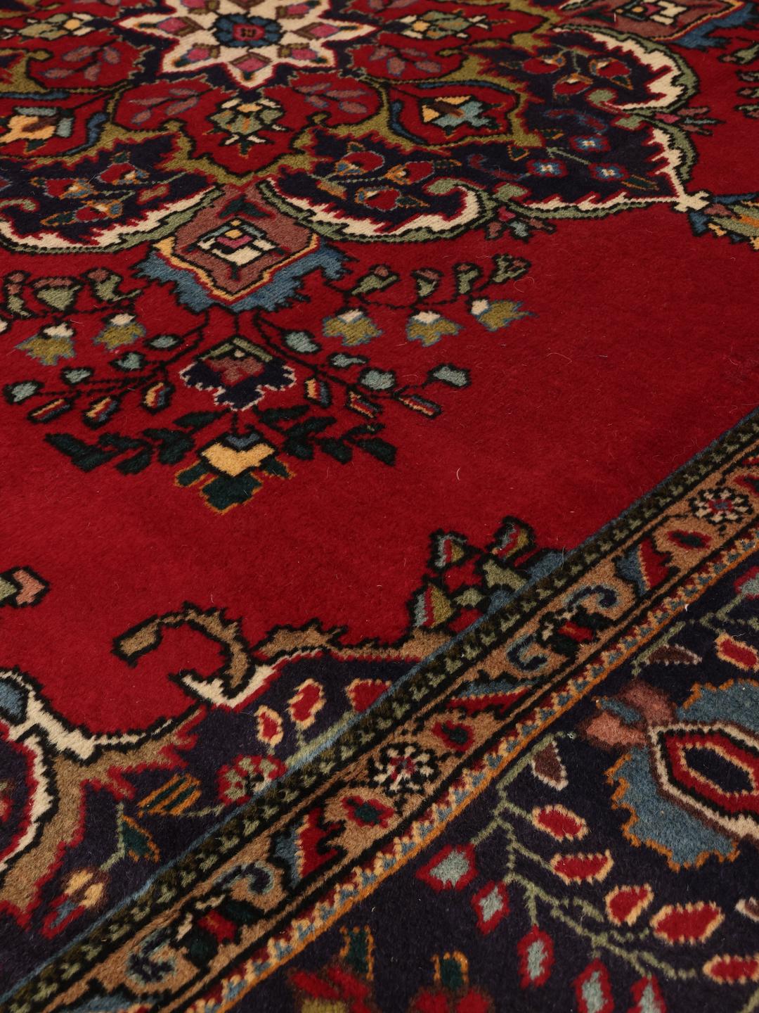Handmade Tabriz rug from the Middle East in red