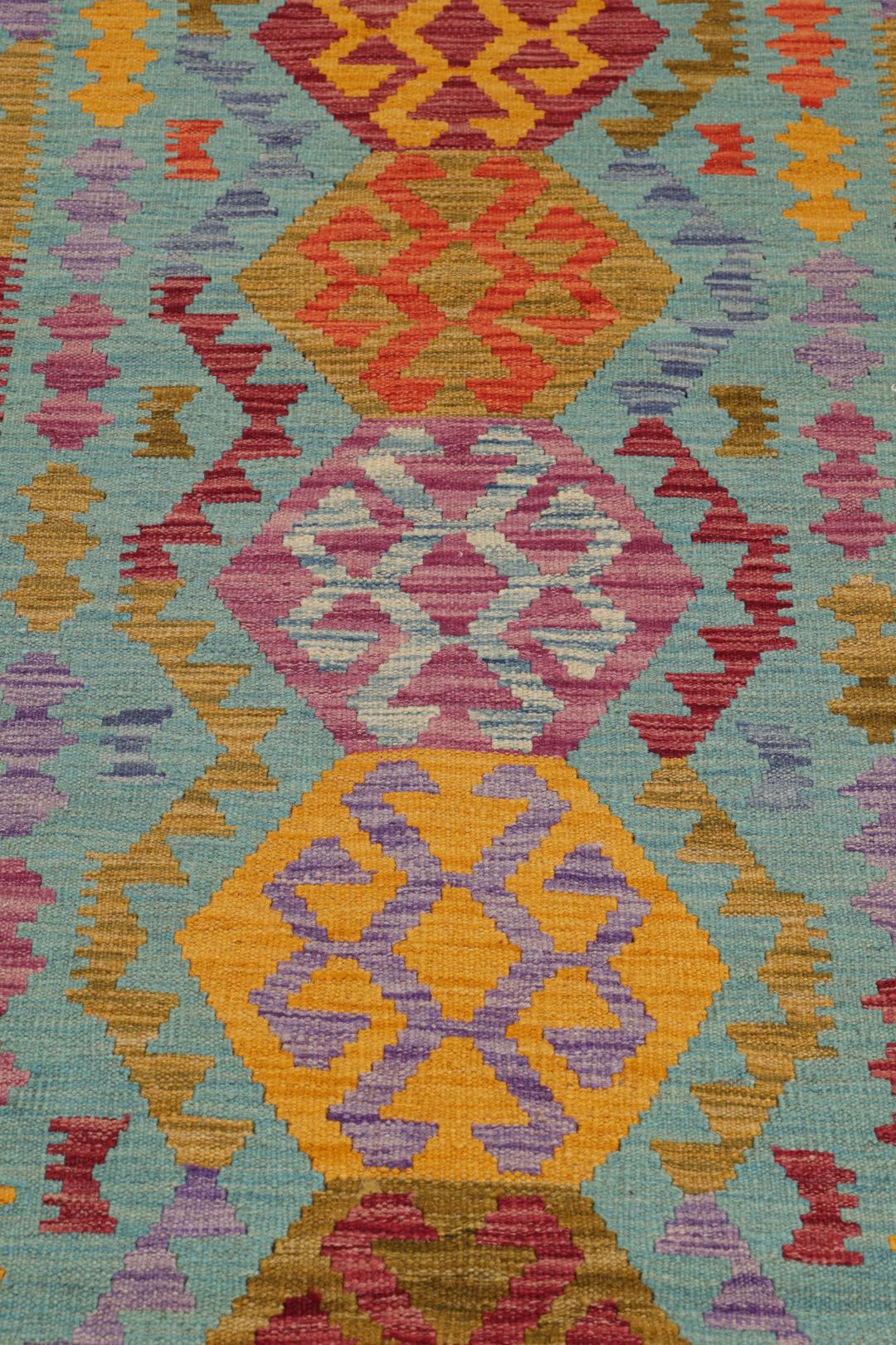 Handgeweven Afghaanse loper met levendige geometrische medaillonpatronen in blauw en meerkleurig