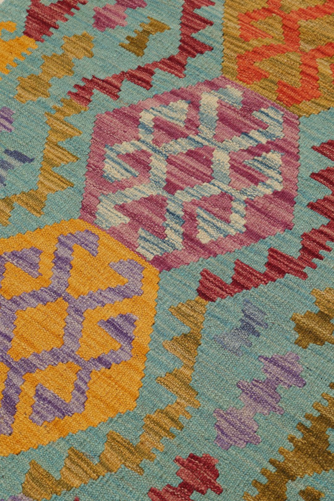 Handgeweven Afghaanse loper met levendige geometrische medaillonpatronen in blauw en meerkleurig