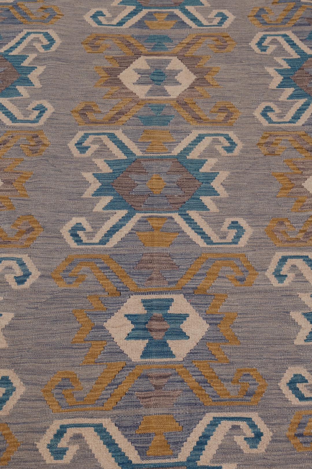 Hand-woven Afghan Kelim rug featuring geometric patterns in blue, yellow, and grey tones.