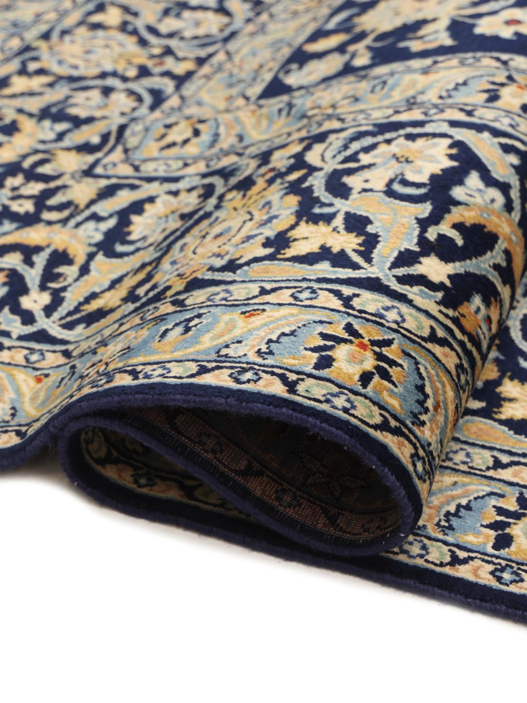 Hand-knotted Keshan rug from the Middle East in deep blue with floral patterns