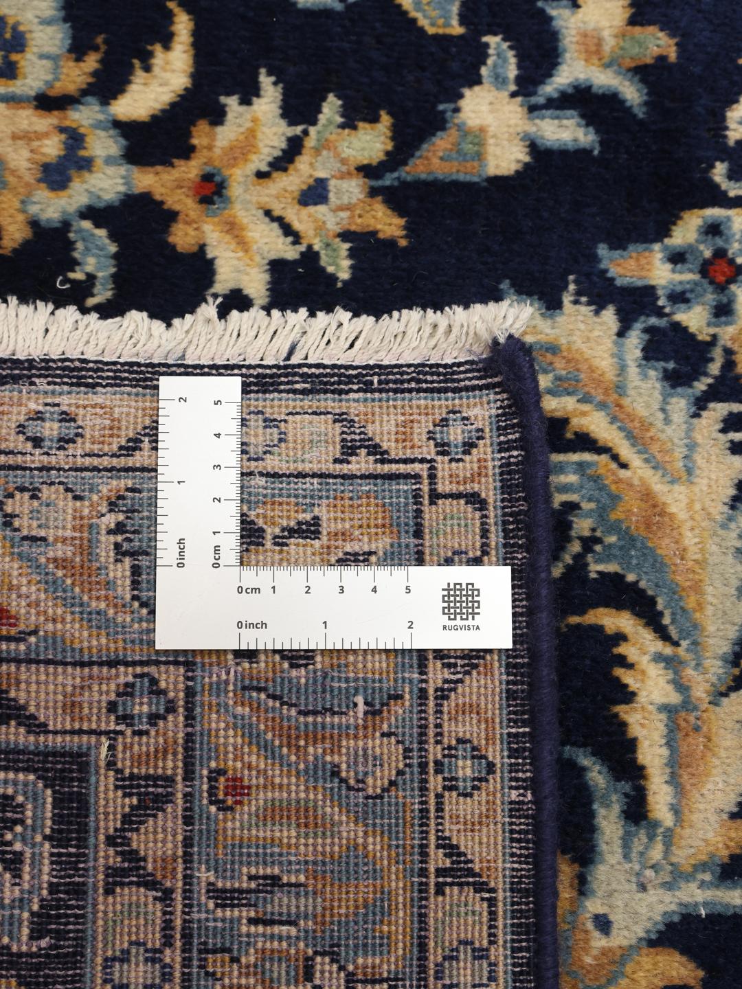 Hand-knotted Keshan rug from the Middle East in deep blue with floral patterns