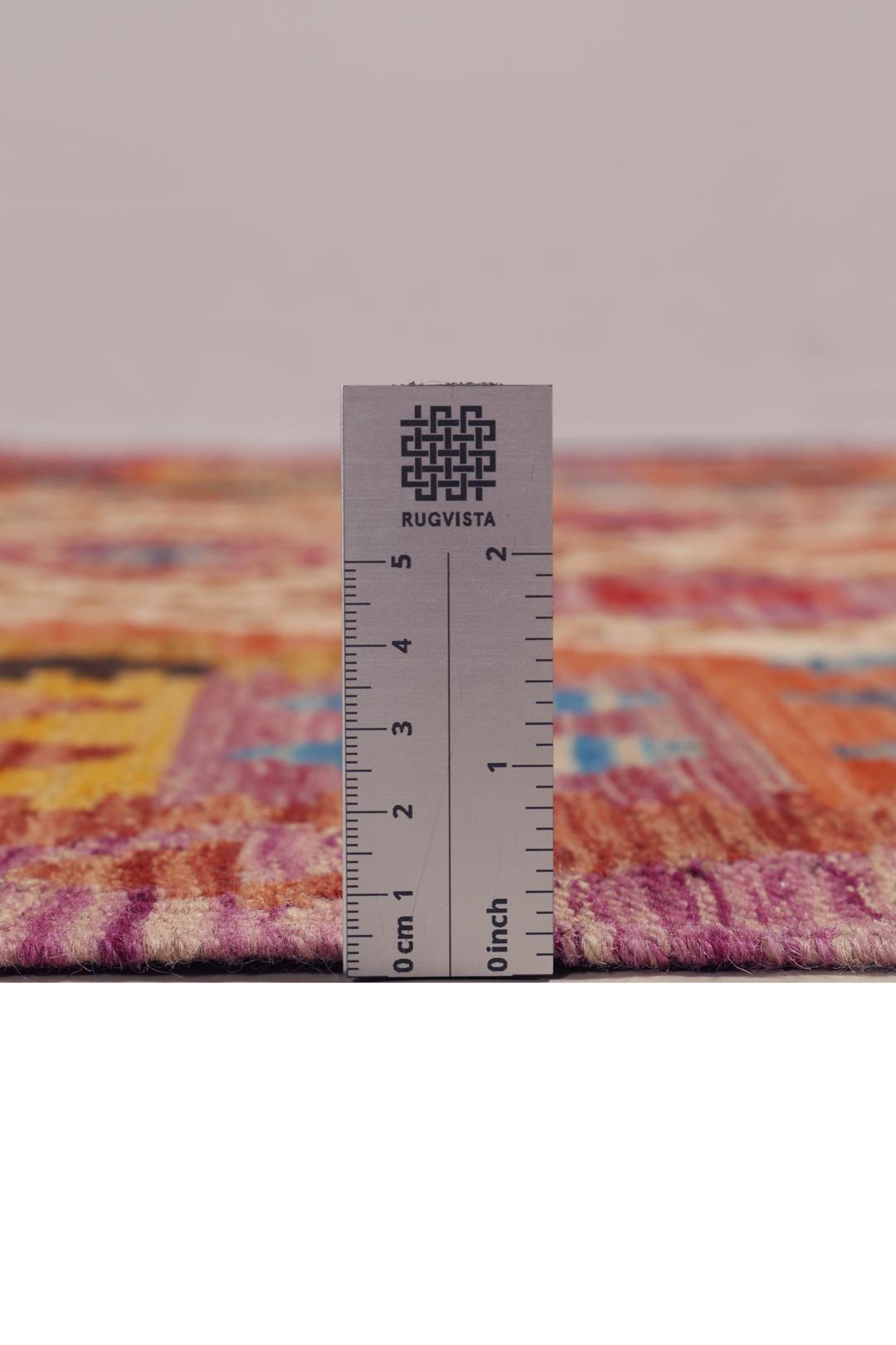 Hand-woven Afghan Kelim rug featuring a vibrant multicolor diamond geometric pattern