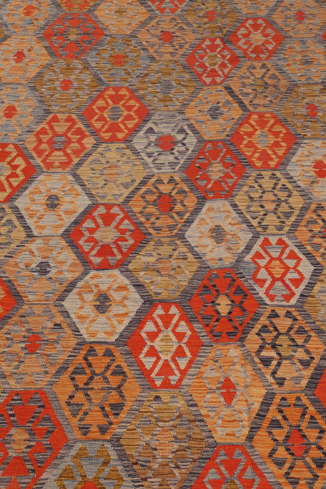 Hand-woven Afghan Kelim rug with geometric patterns in multicolour