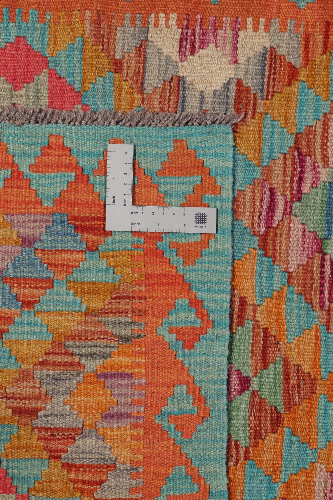 Runner afghano tessuto a mano con un vivace motivo geometrico multicolore