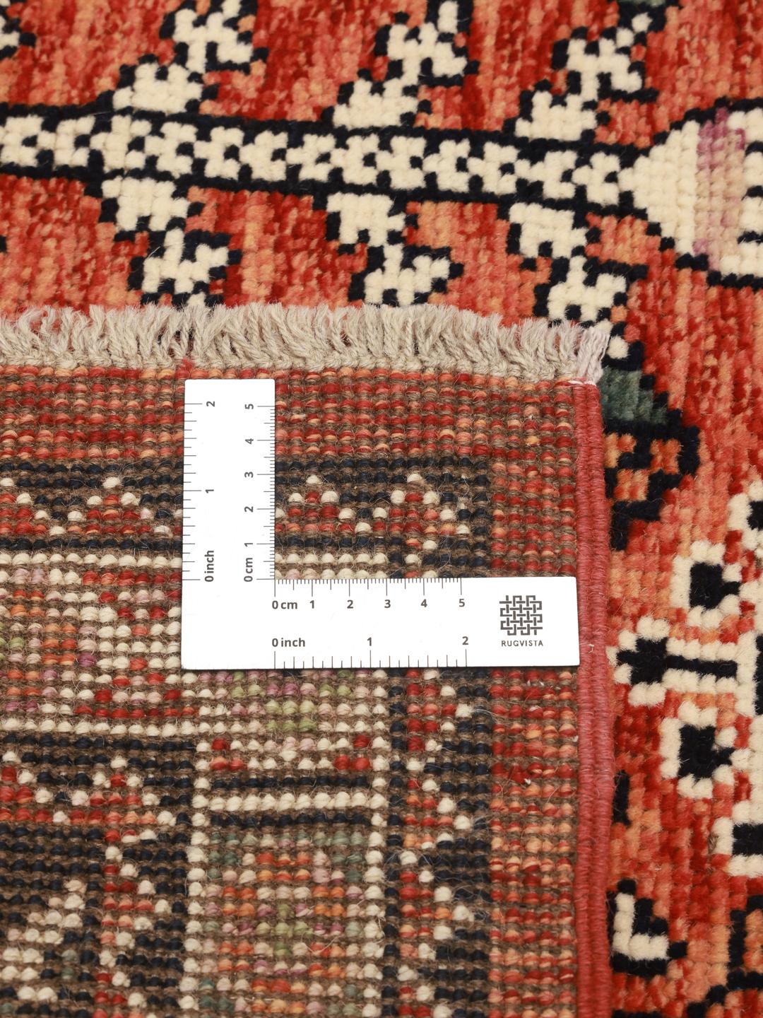 Tapis Kazak noué main originaire d'Afghanistan en rouge et bleu foncé