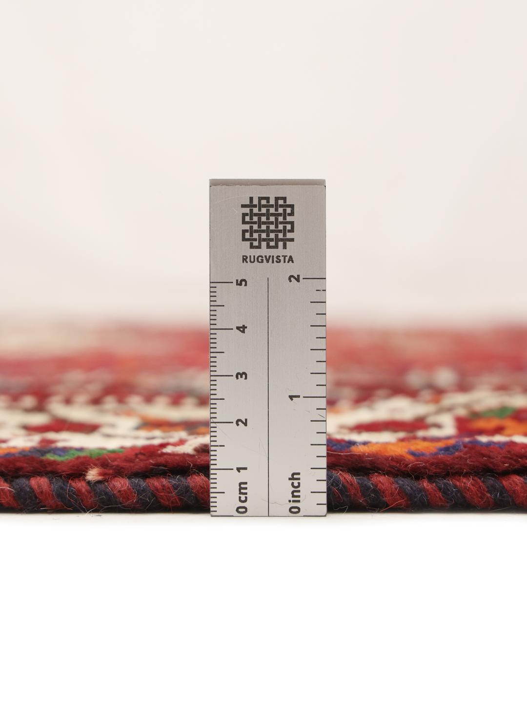 Hand-knotted Shiraz rug from the Middle East in dark red and dark blue