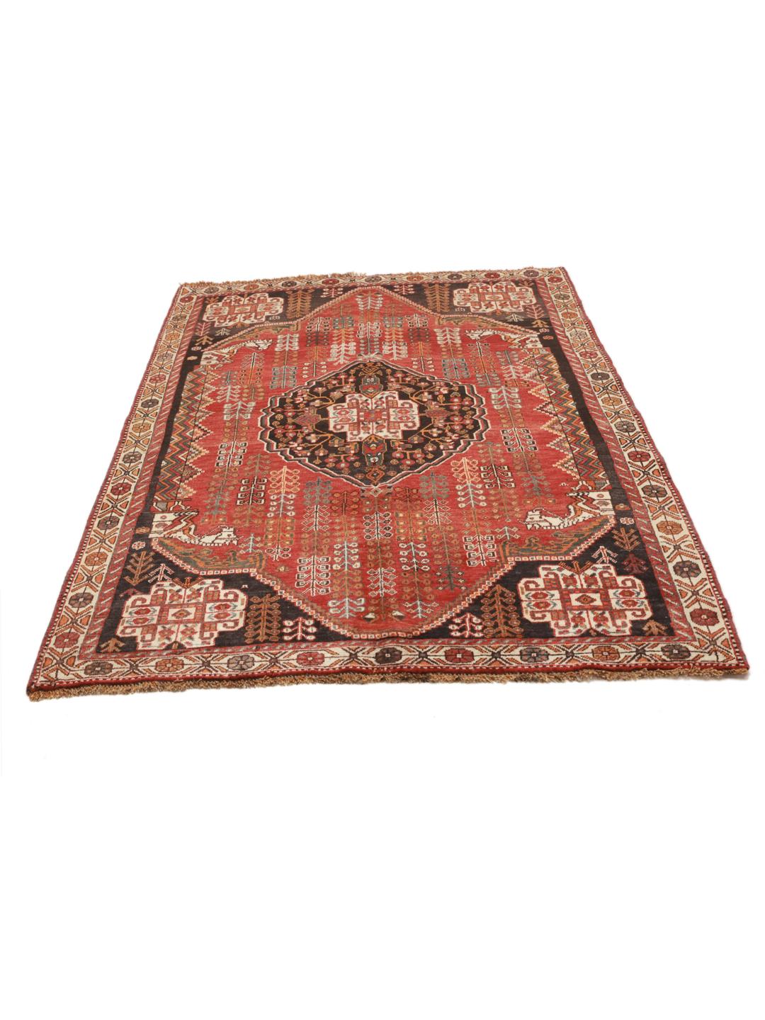 Hand-knotted Ghashghai rug from the Middle East featuring a red and black tribal pattern.