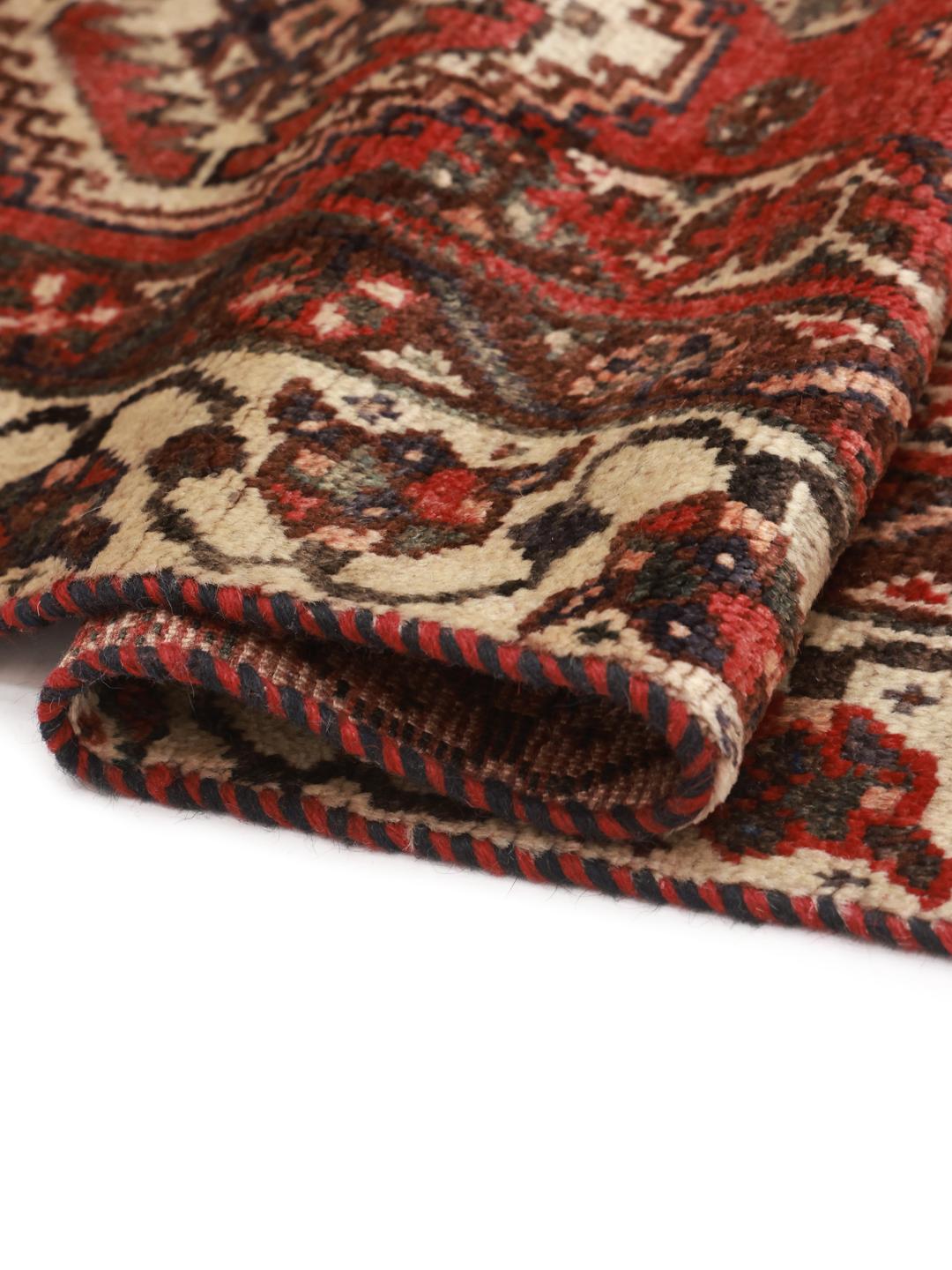 Hand-knotted Shiraz rug from the Middle East in deep red tones