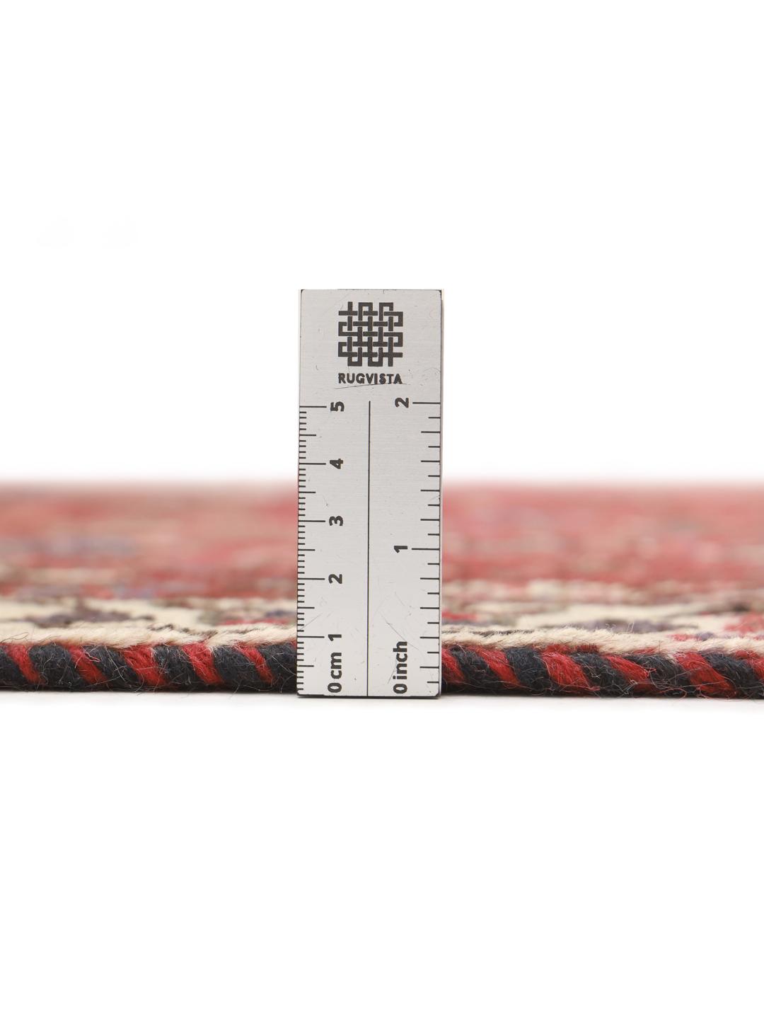 Hand-knotted Shiraz rug from the Middle East in deep red tones