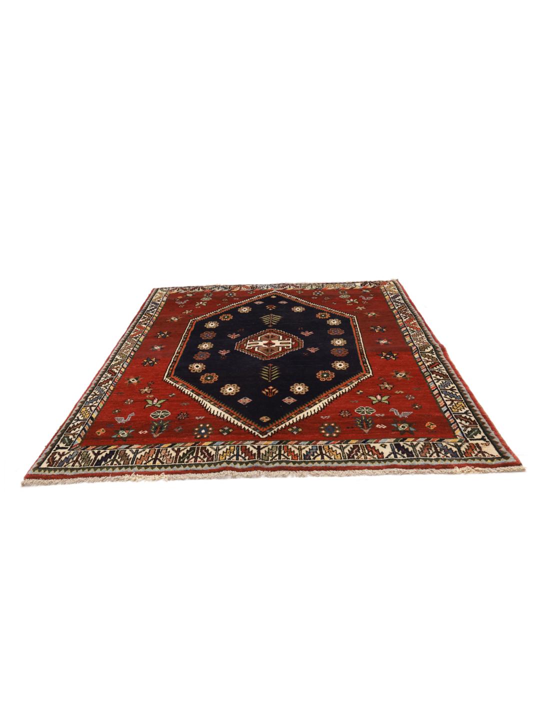 Hand-knotted Ghashghai rug from the Middle East featuring a red and dark blue colour palette