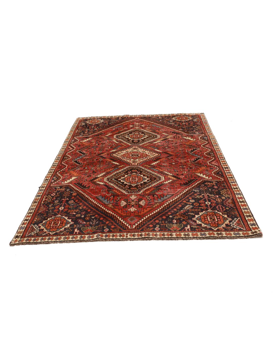 Hand-knotted Ghashghai rug with red and blue tribal geometric patterns from the Middle East