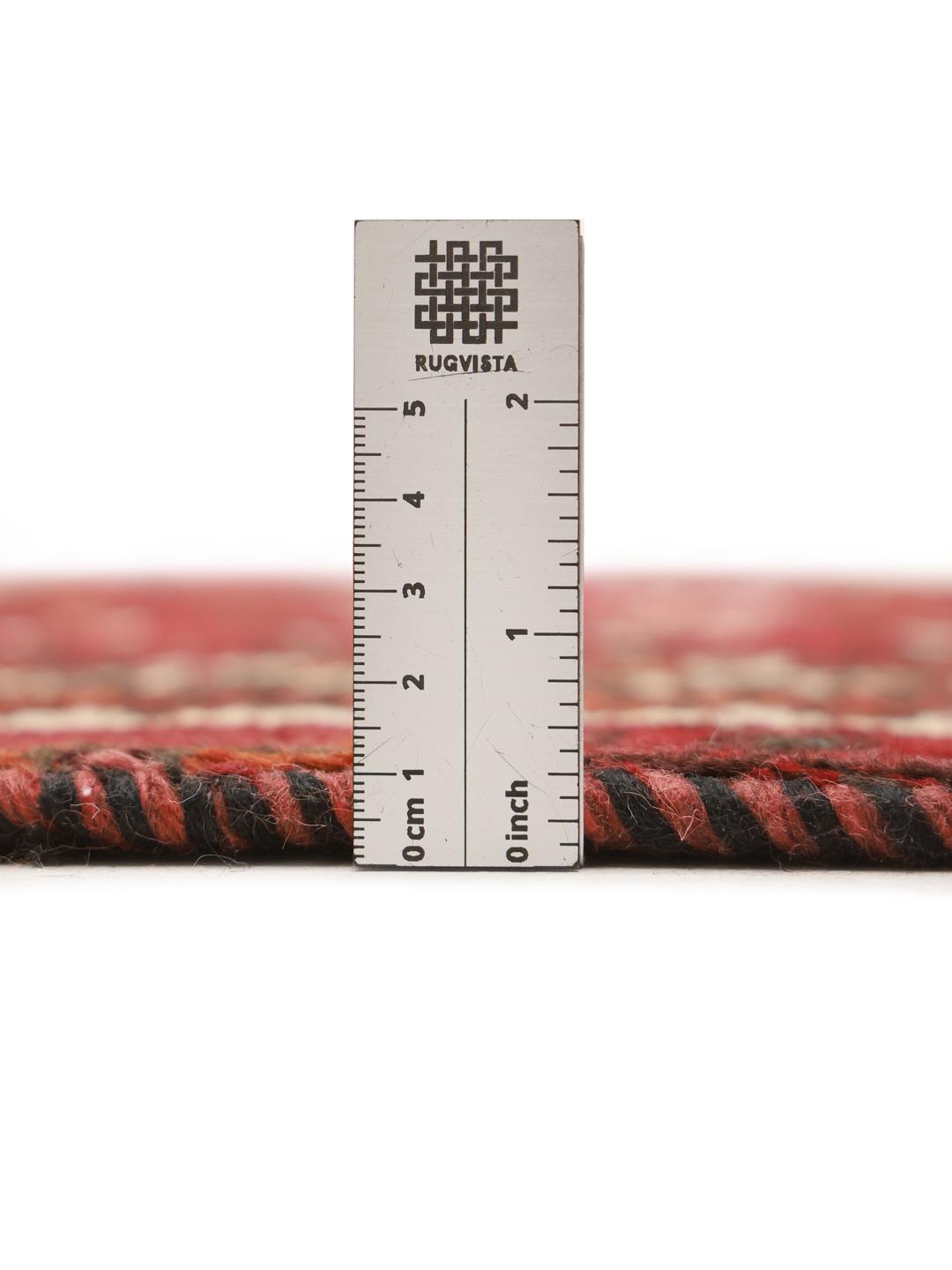 Authentic hand-knotted Ghashghai rug with red and black wool geometric patterns from the Middle East.