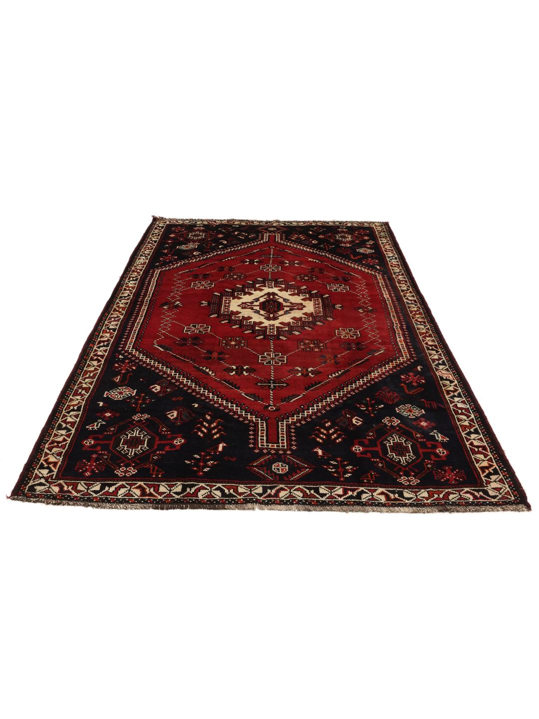 Hand-knotted Middle Eastern rug with red and black geometric patterns