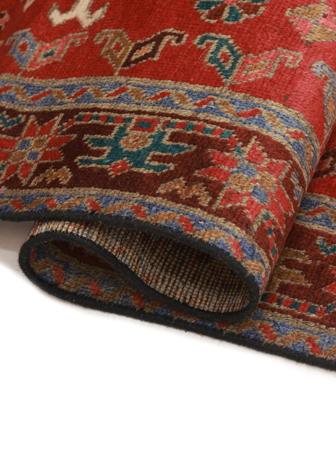 Hand-knotted Middle Eastern runner in red with geometric medallions