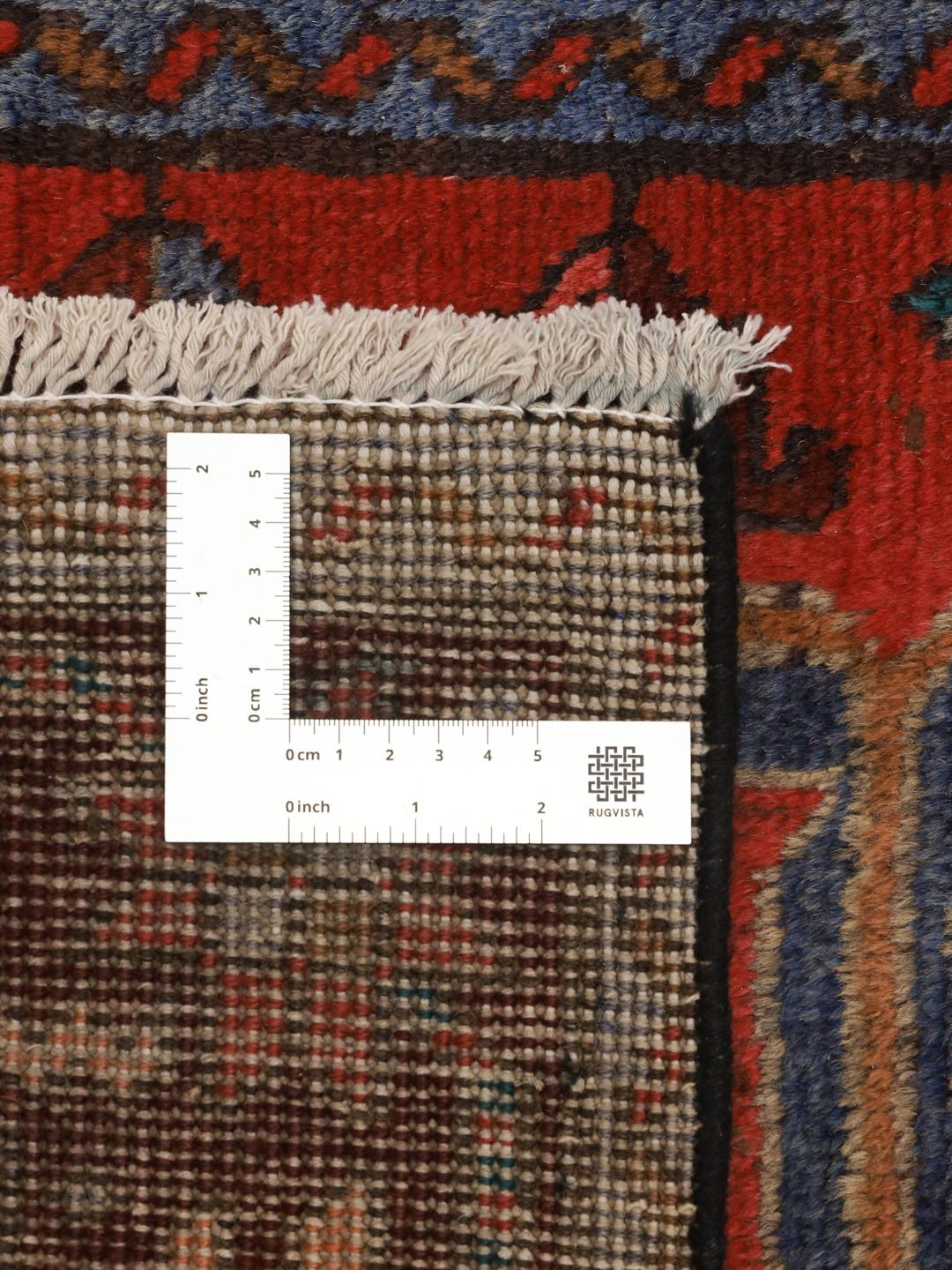 Hand-knotted Middle Eastern runner in red with geometric medallions