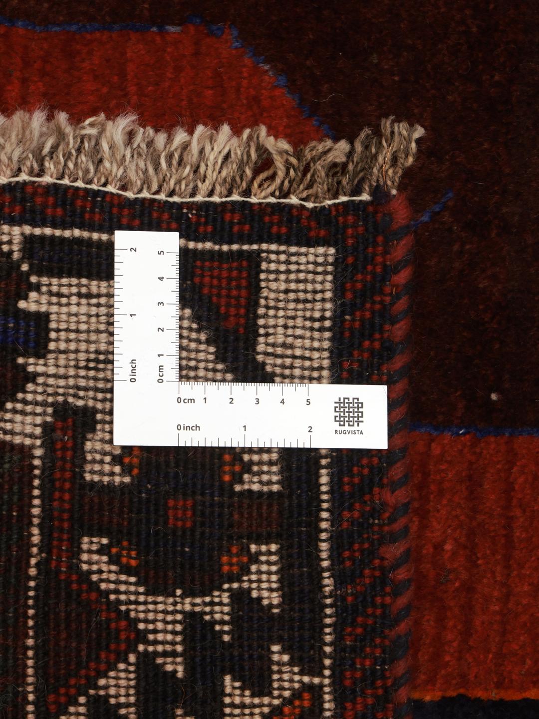 Hand-knotted Ghashghai rug with red field and pictorial motifs