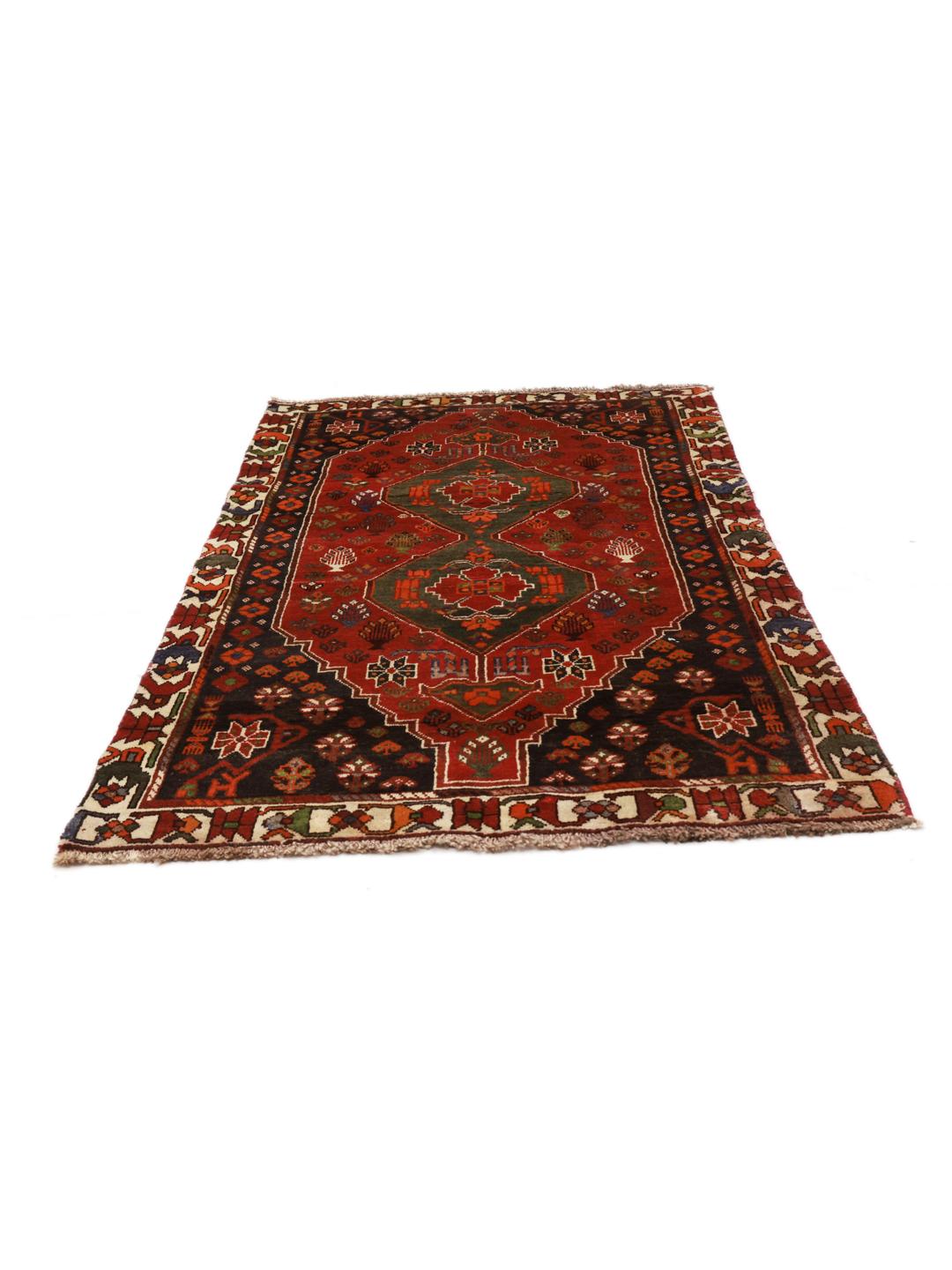 Hand-knotted Shiraz rug from the Middle East featuring a vibrant red and green geometric design.