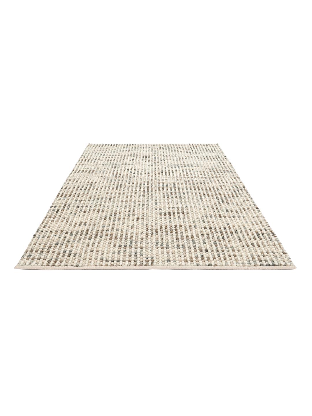 Håndvævet grå og beige tæppe med en struktureret og boblet overflade