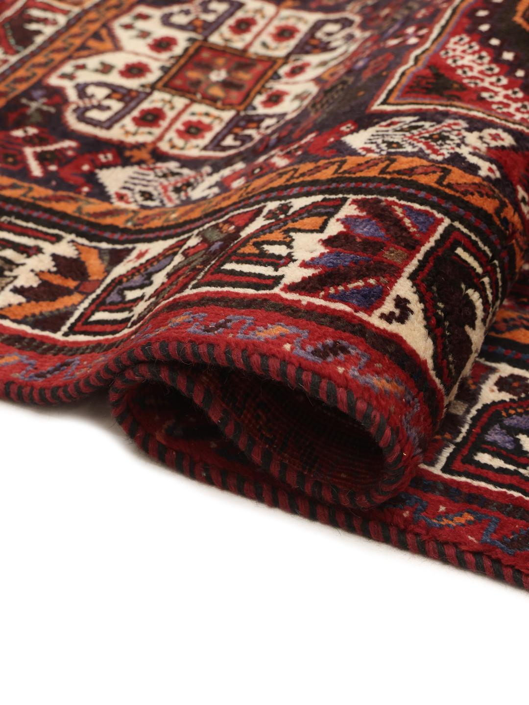 Hand-knotted Ghashghai Wool rug with geometric patterns in red and dark blue